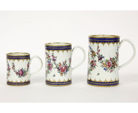 A graduated set of three mugs, Worcester or Caughley, each painted in polychrome with the initials H.C. within floral garland