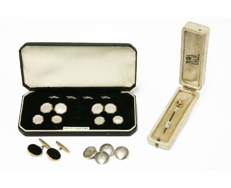 A pair of 9ct gold onyx cufflinks, a 15ct gold and seed pearl stick pin, a pair of sterling silver cufflinks, and a rolled go