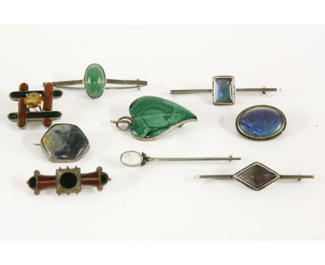 A collection of brooches, to include a sterling silver single stone moonstone brooch, a silver malachite leaf brooch, two Sco