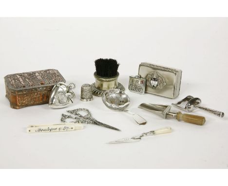 A silver heart shaped vesta, a stamp envelope, a silver shovel, bookmark, and tea caddy, and other desk accessories