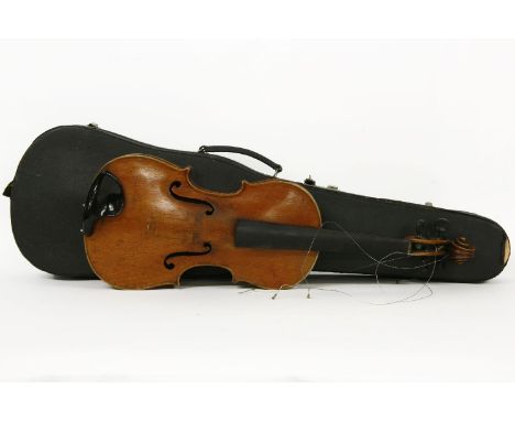 A late 19th century copy of a Stradivarius violin, together with a Bruno Heinze bow, in a case, together with accessories