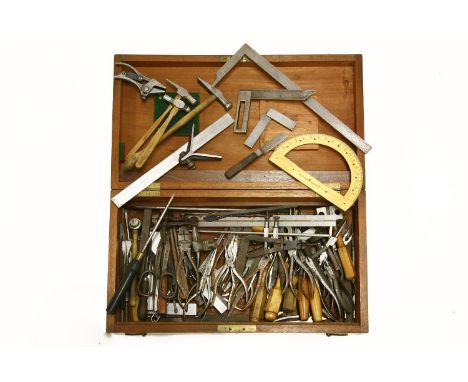 A box of small engineering and other tools, including vices, hammers, pliers, et squares, etc