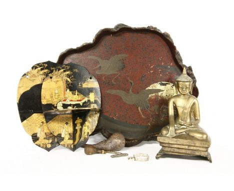 A brass Buddha, pair of folding lacquer wall shelves, a lacquer tray and a gourd powder flask