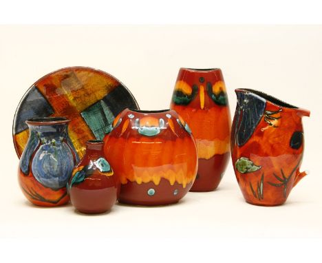 A collection of Delphis Poole pottery, comprising of four vases, a large plate and a jug (af)