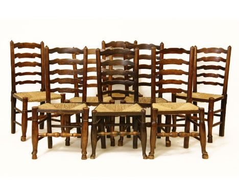 A set of eight Lancashire ladder back chairs, with rush seats