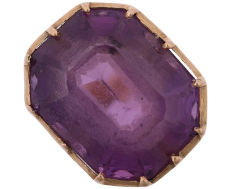 A mid-20th century amethyst dress ring, collet set with emerald step-cut amethyst, apparently unmarked, setting height 16.7mm