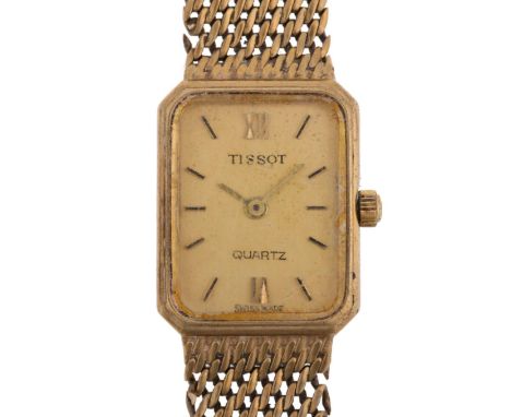 TISSOT - a lady's 9ct gold quartz bracelet watch, circa 1980s, champagne dial with baton hour markers and 9ct mesh strap, imp