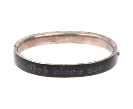 A Victorian French silver and black enamel 'God bless you' hinged mourning bangle, band width 9.2mm, internal circumference 1