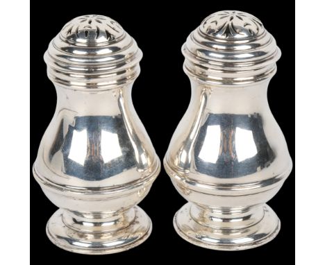 A pair of George VI silver bun pepperettes, Harman &amp; Co, London 1937, in George II style, pedestal baluster form with mou