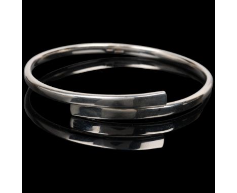 RANDERS SOLVVAREFABRIK - a Danish modernist sterling silver crossover torque bangle, setting height 10.4mm, internal circumfe