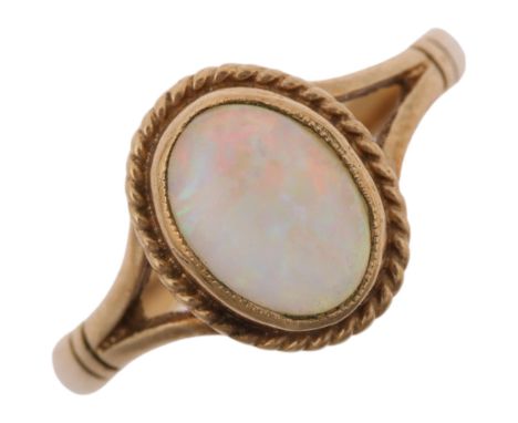 A late 20th century 9ct gold opal dress ring, maker S&amp;S, Birmingham 1995, rub-over set with oval cabochon opal, setting h