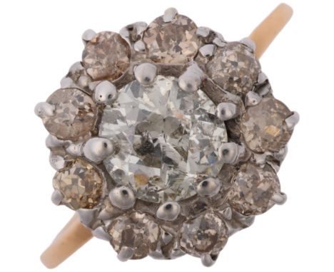 An early 20th century diamond flowerhead cluster ring, centrally claw set with 1ct old European-cut diamond surrounded by old