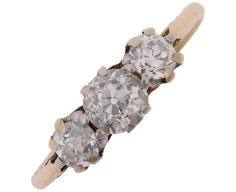 An early 20th century 18ct gold three stone diamond ring, claw set with old European-cut diamonds, total diamond content appr