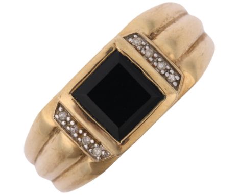 A large modern 9ct gold onyx and diamond signet ring, setting height 9.4mm, size V, 4.3g Condition Report: No damage or repai