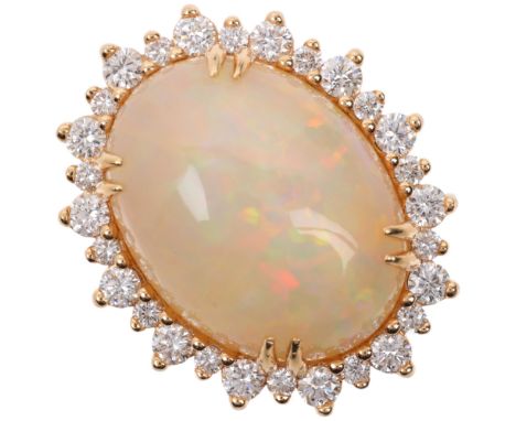 An impressive 18ct gold Ethiopian opal and diamond oval cluster ring, centrally double claw set with 10.5ct oval cabochon opa