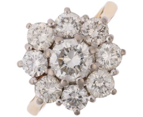 A late 20th century 18ct gold diamond flowerhead cluster ring, indistinct maker, London 1983, claw set with modern round bril