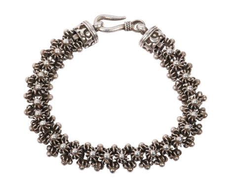 CREOL/PER NILSON - a heavy Danish sterling silver Folk Art celestial bracelet, with applied cannetille flowerhead motifs, 19c