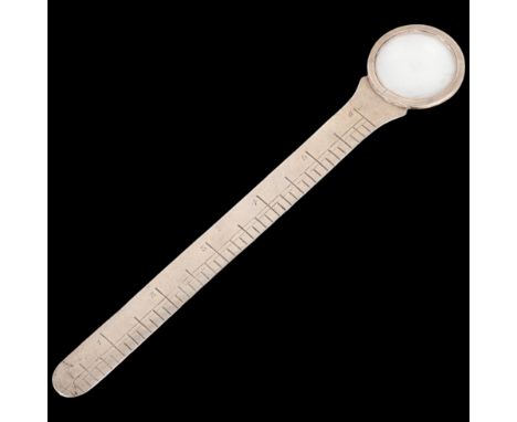 A George V novelty silver combination magnifying glass/ruler, probably by Stuart Clifford &amp; Co, London 1912, 20cm Conditi