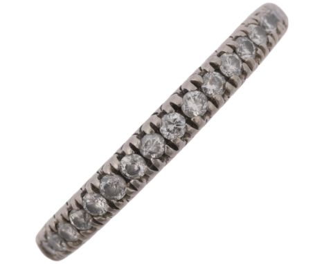 A modern platinum diamond half eternity ring, claw set with modern round brilliant-cut diamonds, total diamond content approx