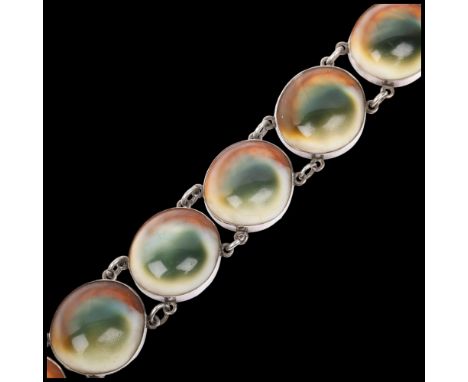 A large Antique operculum shell panel bracelet, 18.5cm, 63.3g Condition Report: Light crazing to shell panels otherwise no da