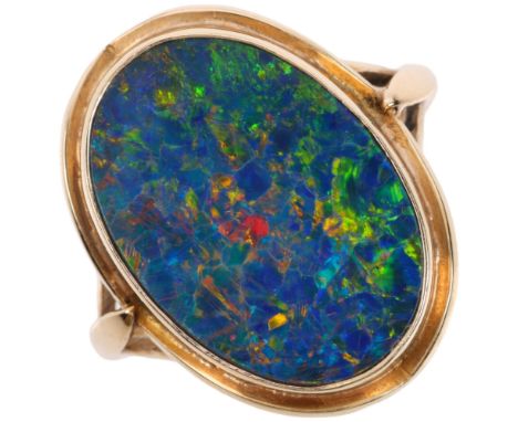 A late 20th century black opal doublet dress ring, apparently unmarked Continental gold settings, setting height 20mm, size P