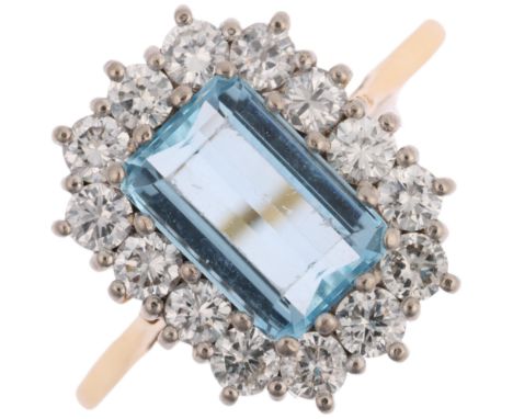 An 18ct gold aquamarine and diamond rectangular cluster ring, claw-set with 1.4ct octagonal step-cut aquamarine, surrounded b