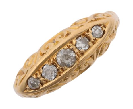 An early 20th century 18ct gold graduated five stone diamond half hoop ring, indistinct maker, Birmingham 1916, set with old-
