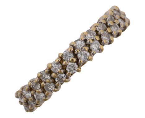 A late 20th century 18ct gold diamond double-row half eternity ring, maker VJ, import London 1986, set with modern round bril