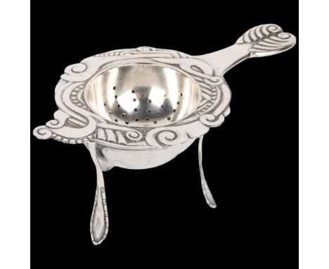 An Art Nouveau Danish silver tea strainer and stand, circa 1917 and 1920, strainer 13cm, stand height 5.5cm, 2.3oz total Cond