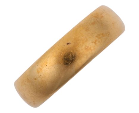 An early 20th century 22ct gold wedding band ring, maker RJ, London 1917, band width 5.5mm, size K, 7.6g Condition Report: No