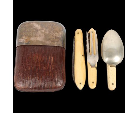 A George V silver-mounted leather travelling eating set, James Dixon &amp; Sons Ltd, Sheffield 1919, opening to reveal bone f