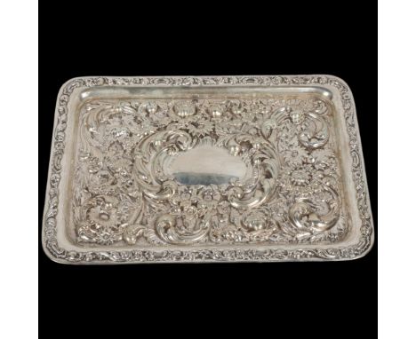 An Edwardian silver dressing table tray, Walker &amp; Hall, Sheffield 1904, allover high relief embossed foliate and grapevin