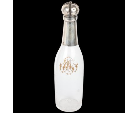 An unusual Antique French silver-mounted glass 'Champagne Bottle' decanter, Paris, circa 1900, with etched and gilded monogra