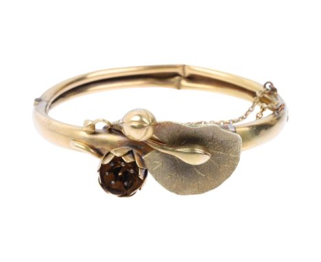 A 1960s floral hinged bangle, apparently unmarked but assumed 9ct, setting height 20.8mm, internal circumference 16cm, 15g Co