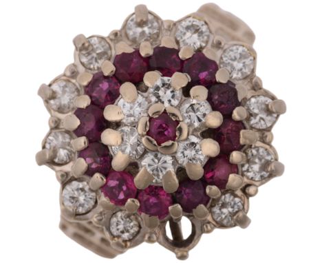 A late 20th century 18ct white gold ruby and diamond flowerhead cluster ring, maker J Ltd, London 1975, set with modern round