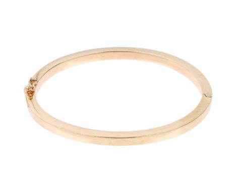 A 9ct gold plain hinged bangle, band width 4.1mm, internal circumference 18cm, 10.7g Condition Report: No damage or repair, o