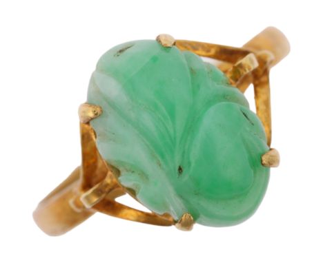 A Chinese 14ct gold carved jade panel ring, setting height 13.7mm, size T, 4.2g Condition Report: No damage or repair, engrav