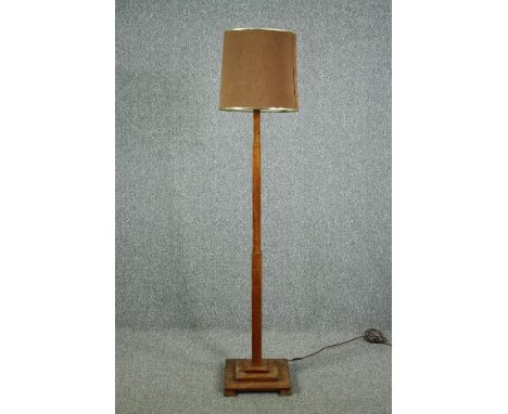 A mid century Art Deco style oak standard lamp. H.176cm. 