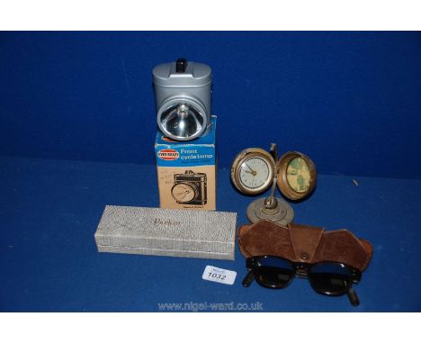 An old Bicycle Lamp, globe shaped Clock, pair of Sunglasses in leather case, etc.