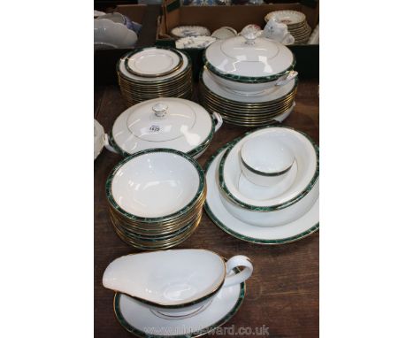 A Royal Worcester Medici part Dinner service comprising nine dinner plates, six each soup plates and cereal bowls,18 plain an