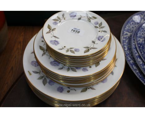 A quantity of Royal Worcester Dinner, side and tea plates in Cornflower pattern.