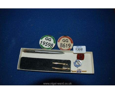 A Bus Driver's Badge and a Conductor's Badge and various enamel badges and pens