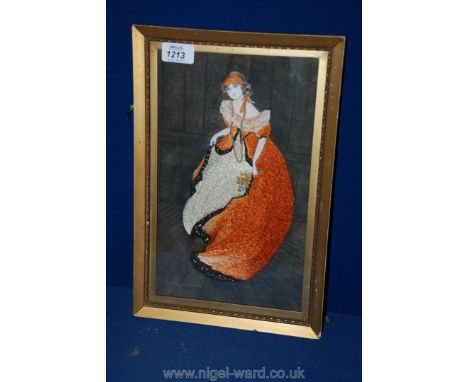 A framed Tapestry of a Crinoline Lady.