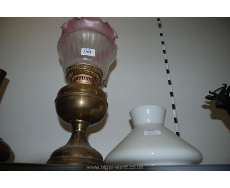 An oil lamp with shade plus one other shade.