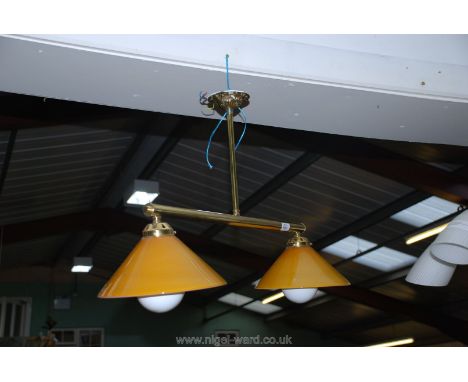 A Brass dining Centre Light with gold coloured glass shades