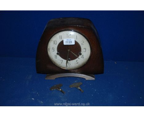 A Smiths mantle Clock with Westminster chimes and two keys.