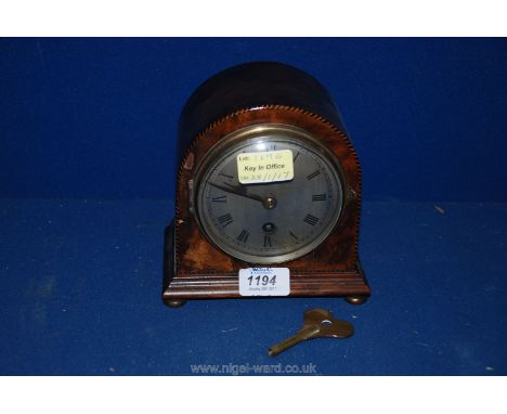A small Mahogany mantle Clock on four bun feet, having tin face with Roman numerals, Movement by Coventry Astral No 1251, wit