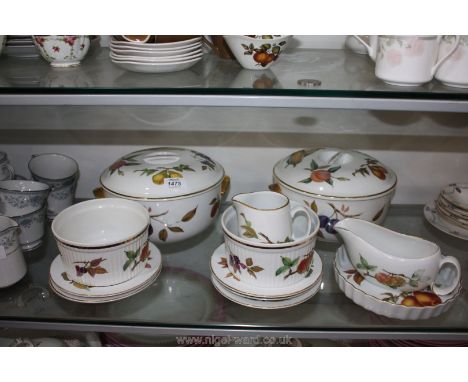 A quantity of Royal Worcester 'Evesham Gold' dinnerware including two lidded Tureens, jug, sauce boat, etc.