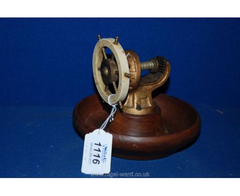 A Brass & Mahogany Nut Cracker in the Form of a Ship's Wheel.