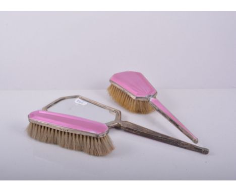 Four piece silver and pink enamel dressing table set, Birmingham 1933, including a hand mirror, 30cm.